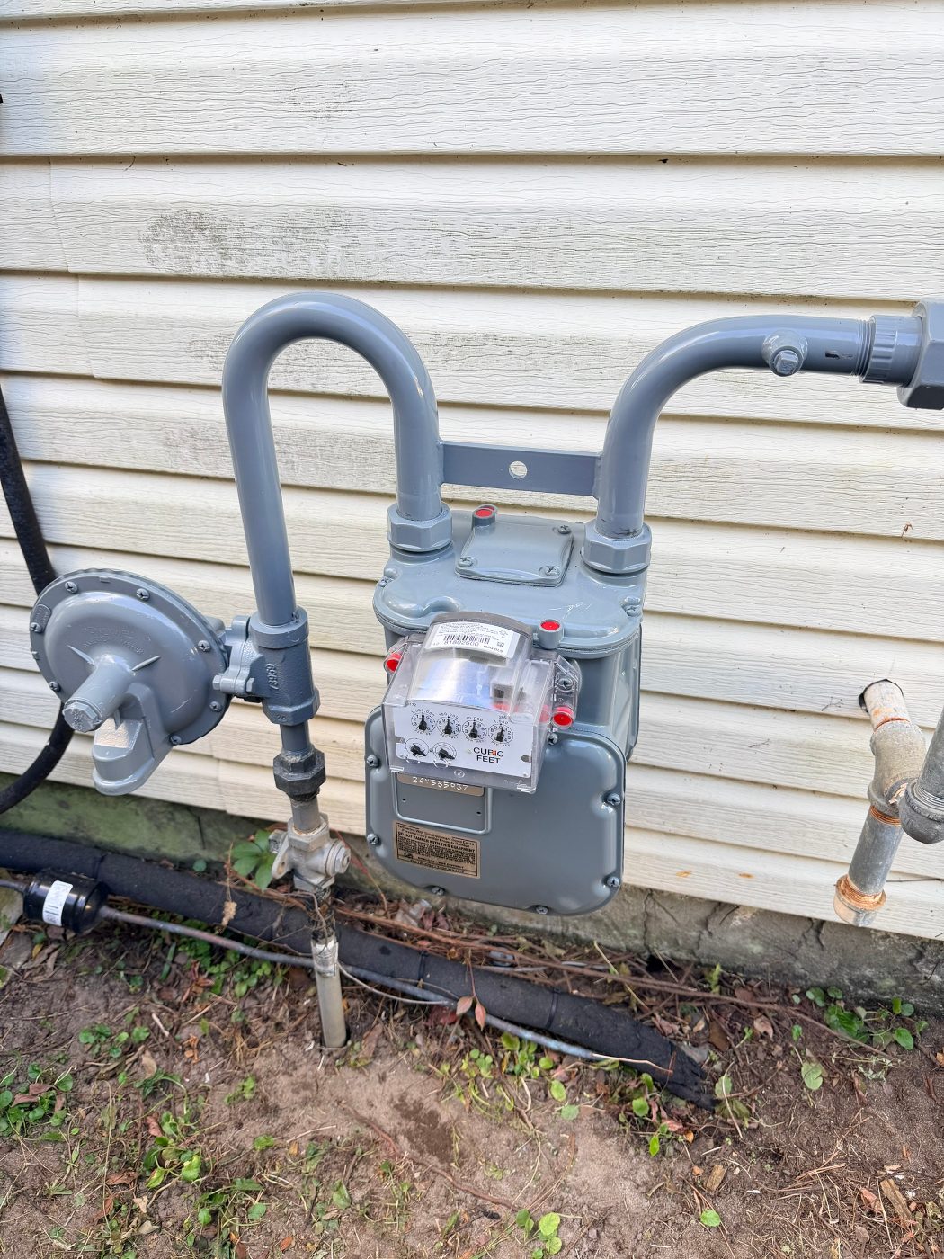 New gas meter and freshly painted piping installed by Okaloosa Gas